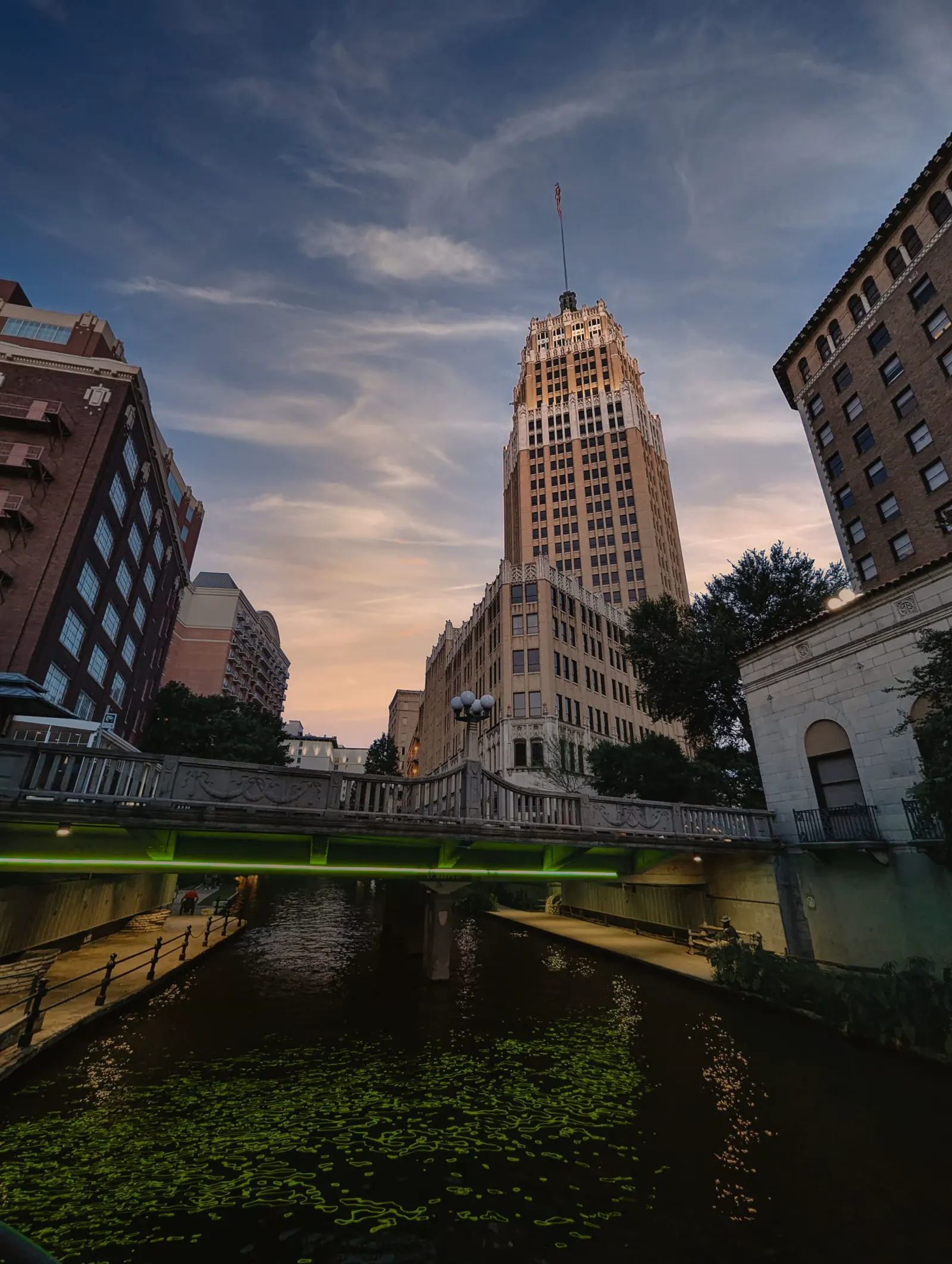 Tower Life Building and the River Walk in San Antonio at dusk. San Antonio, Texas