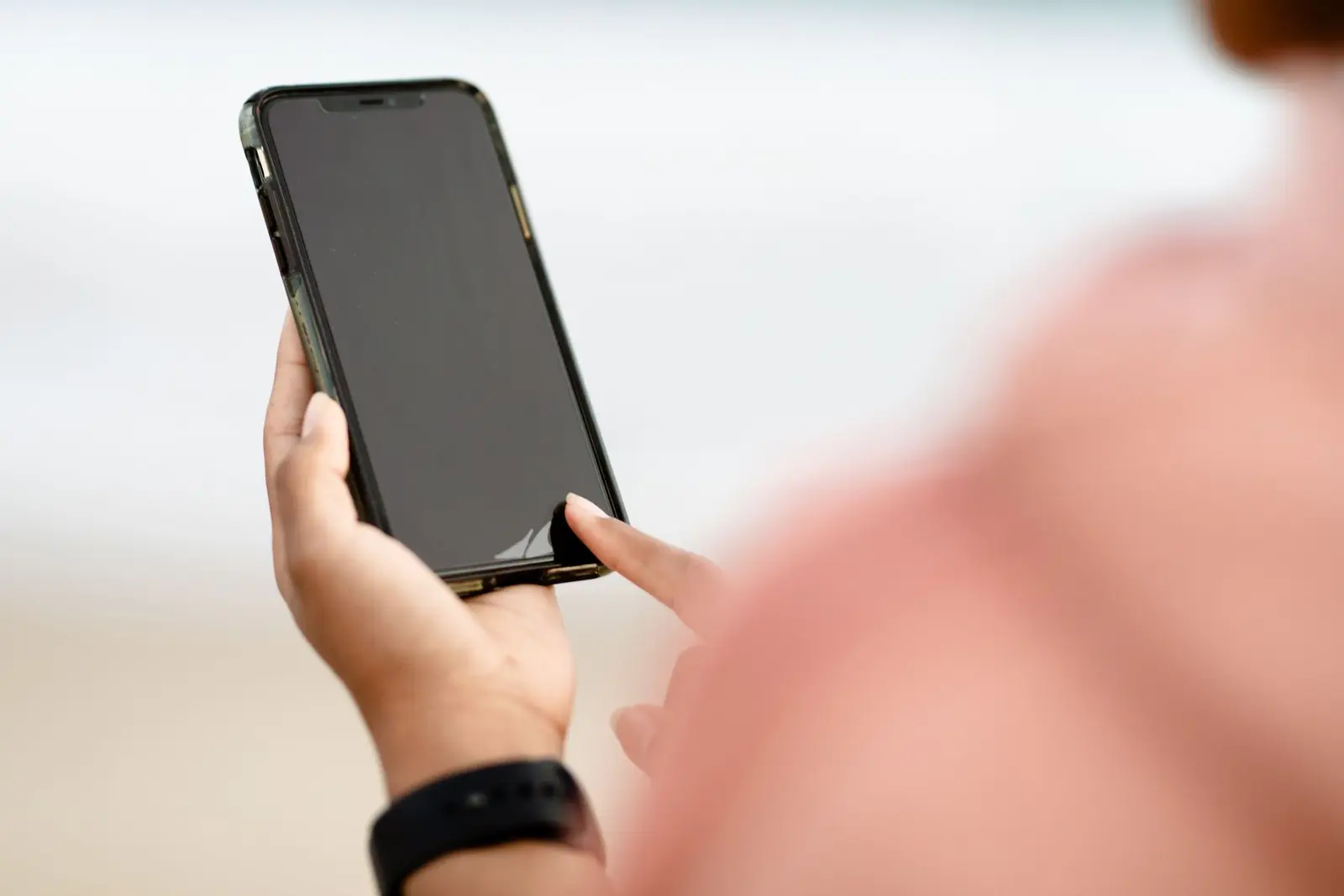 Person using a smartphone outdoors. Mobile Friendly Website Checklist for Local Businesses